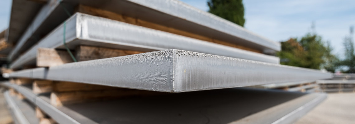 Steel plates stored on a rack.